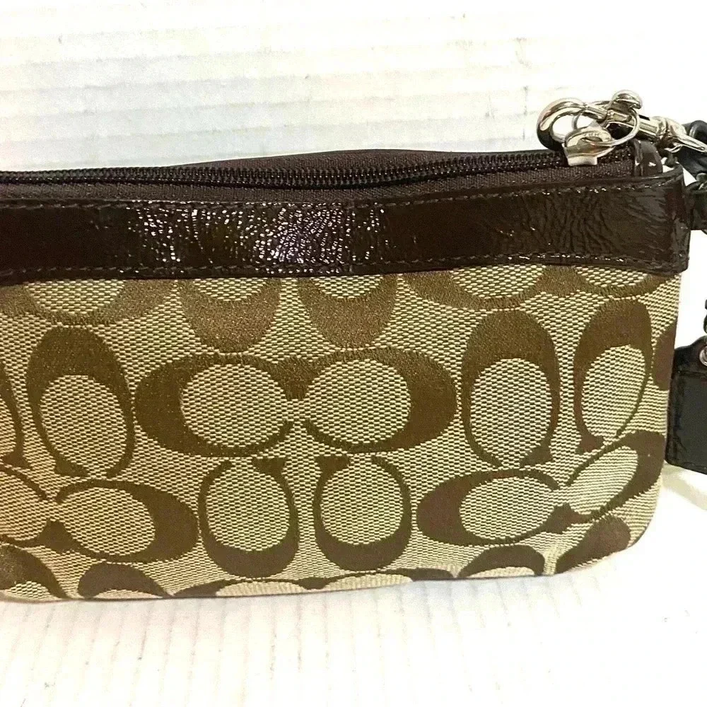 Coach CC signature print canvas wristlet
